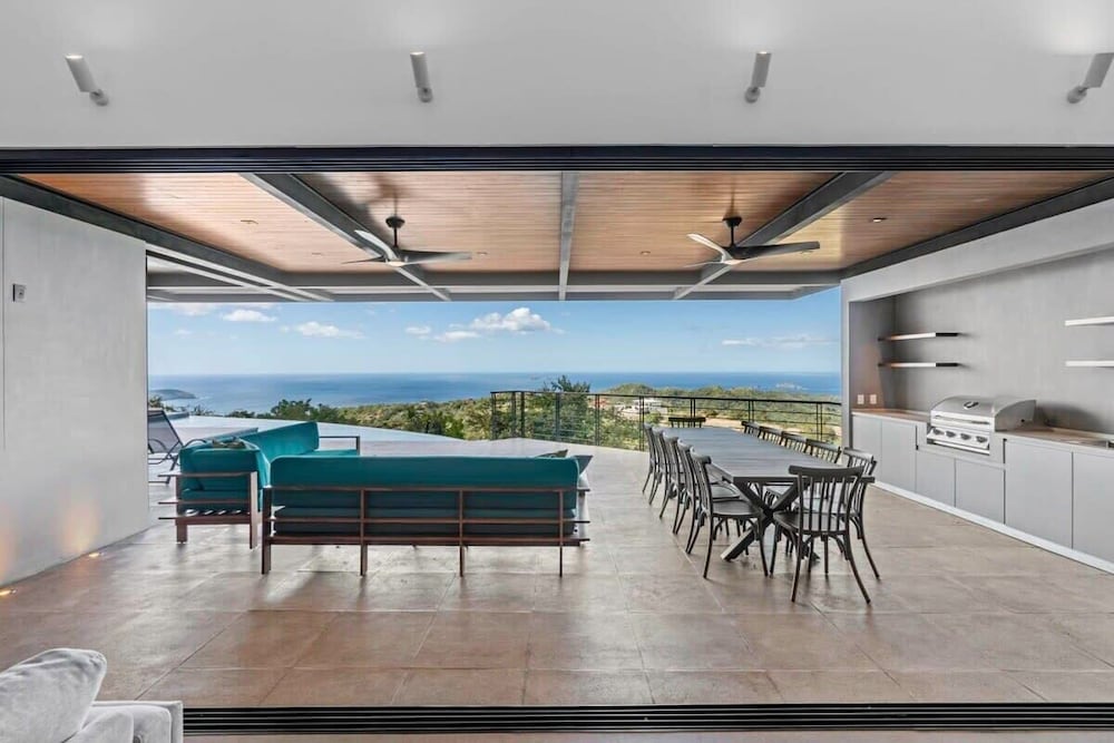 Luxurious Ultramodern Property with Private Suites, Infinity Pool, and Sweeping Ocean and Mountain Views