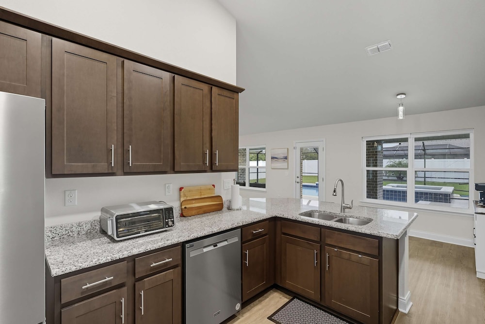 Modern 4BR Retreat Near Beach Heated Pool
