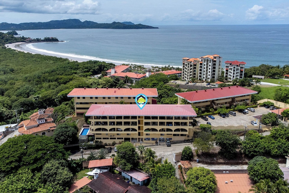 Remodeled Top-Floor Condo with Stunning Wrap-Around Balcony Offering Mountain, Ocean & Marina Views