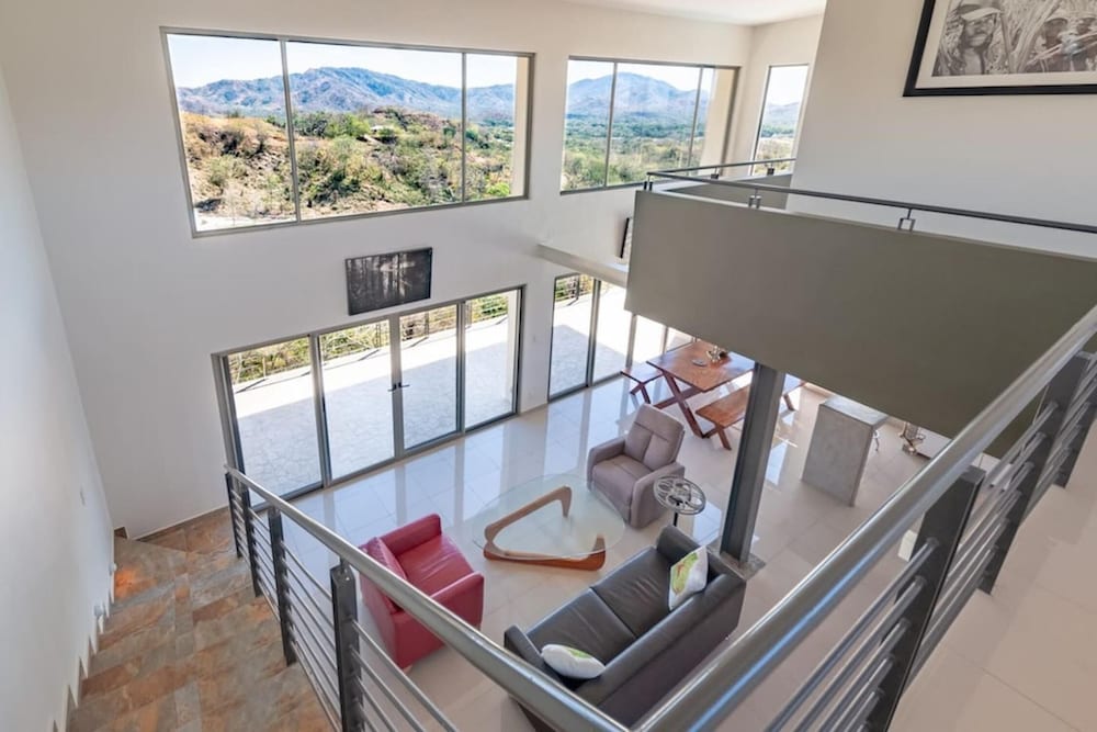 Modern Hillside Home with Sleek Interiors and Panoramic Poolside Views view 4