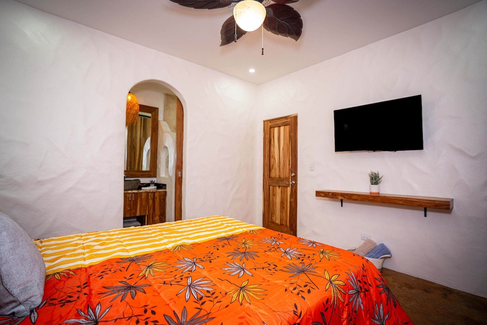 Bohemian Tropical Villa with a Tiki-Style Swimming Pool & Swim-Up Bar with an Attached Studio Apartment