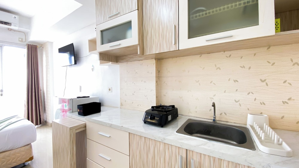 Homey And Cozy Living Studio At Poris 88 Apartment