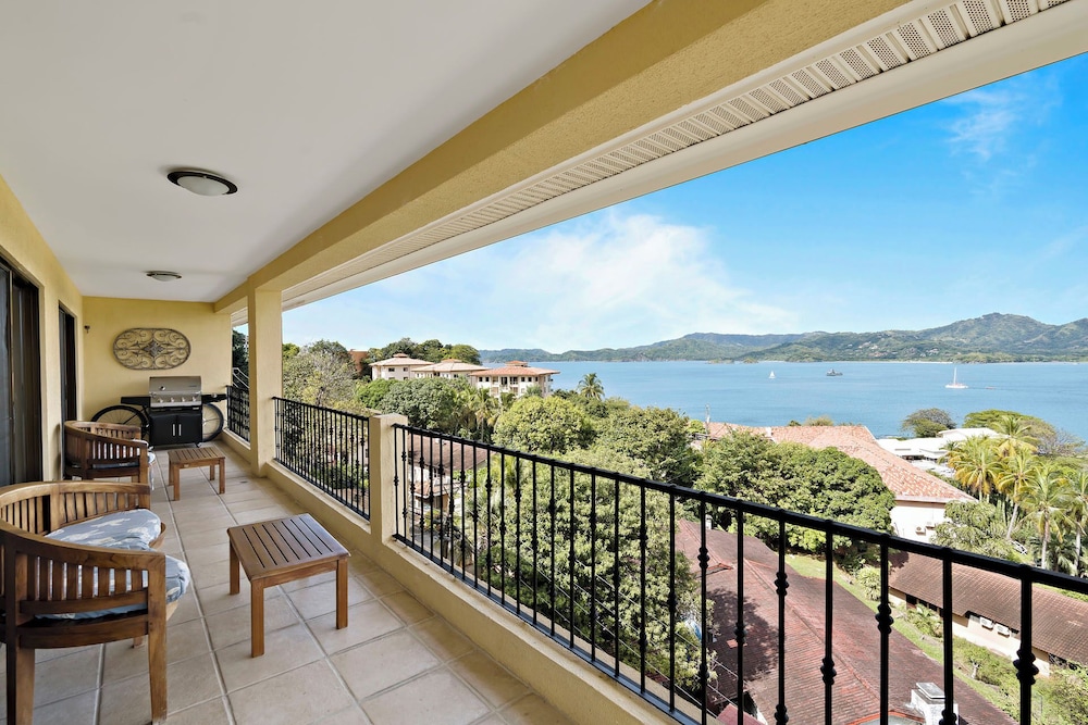 Remodeled Top-Floor Condo with Stunning Wrap-Around Balcony Offering Mountain, Ocean & Marina Views