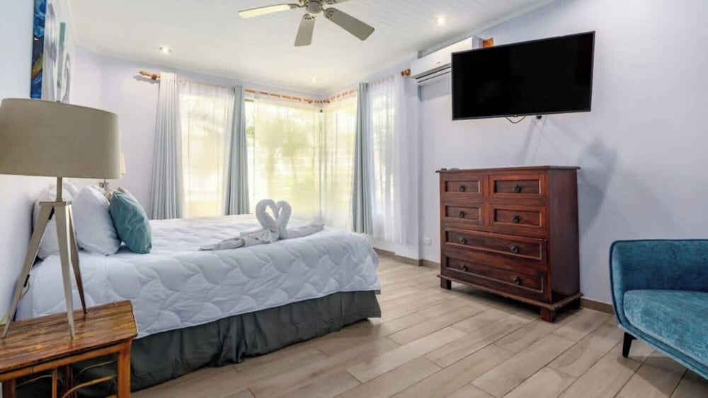 Elegant Condo with Brand-New Fixtures, Shaded Tropical Terrace, and Secluded Beach Access
