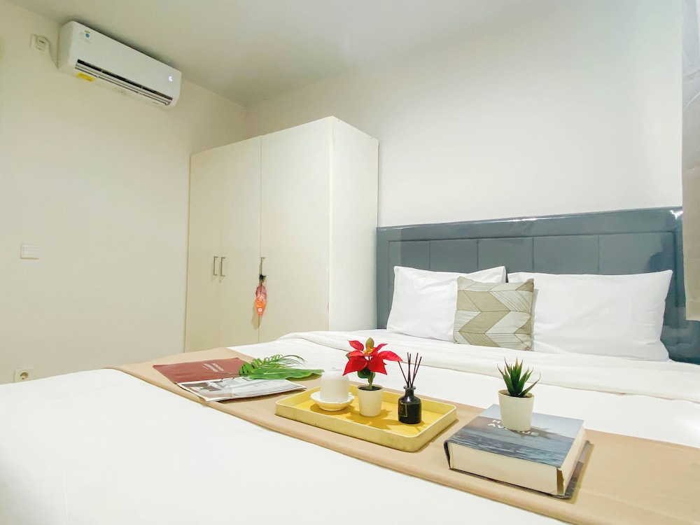 Simple 2Br At Azalea Suites Apartment