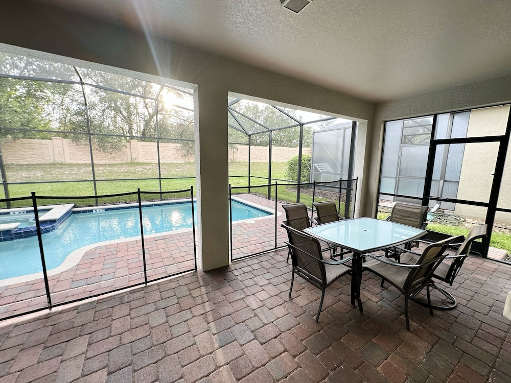 1469rf-the Retreat At Championsgate 9 Bedroom Home by RedAwning view 3