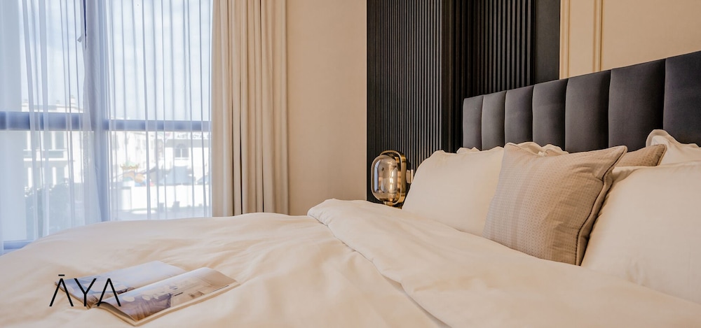 Aya - Modern 1BR Apartment with Balcony in Rahaal 2 — bedroom