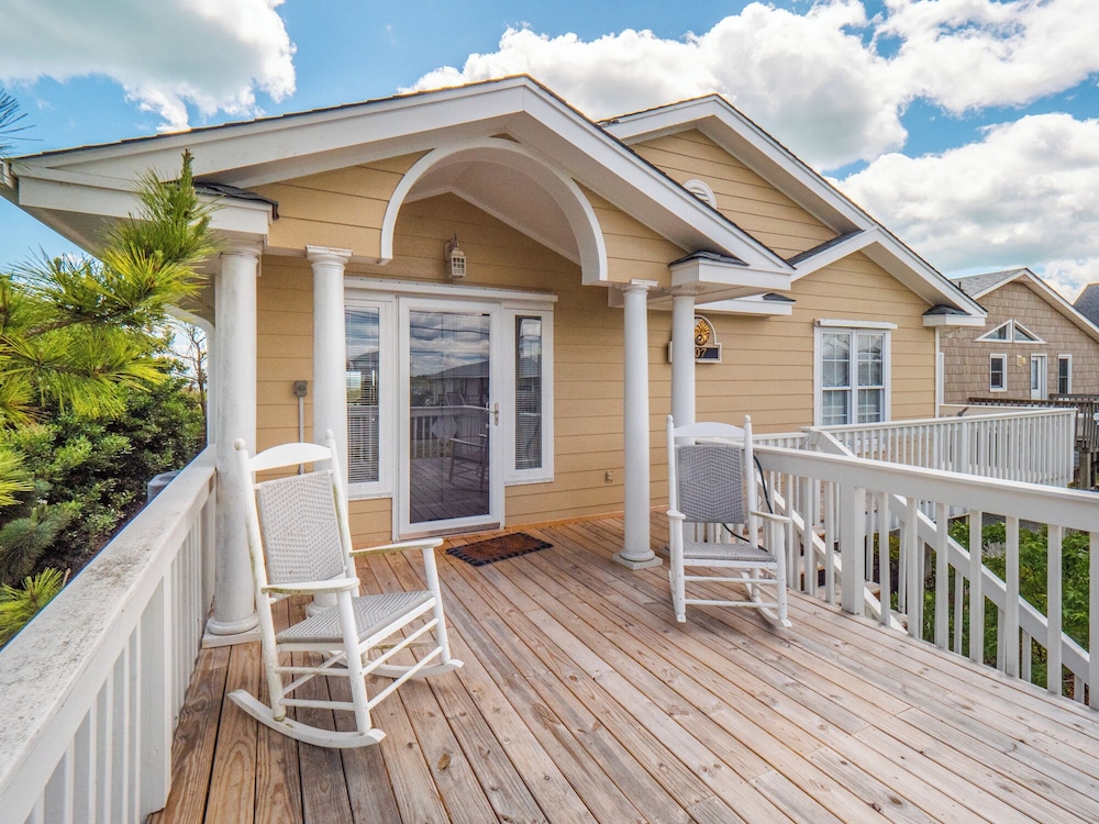 A Charm of Finches by Topsail Realty