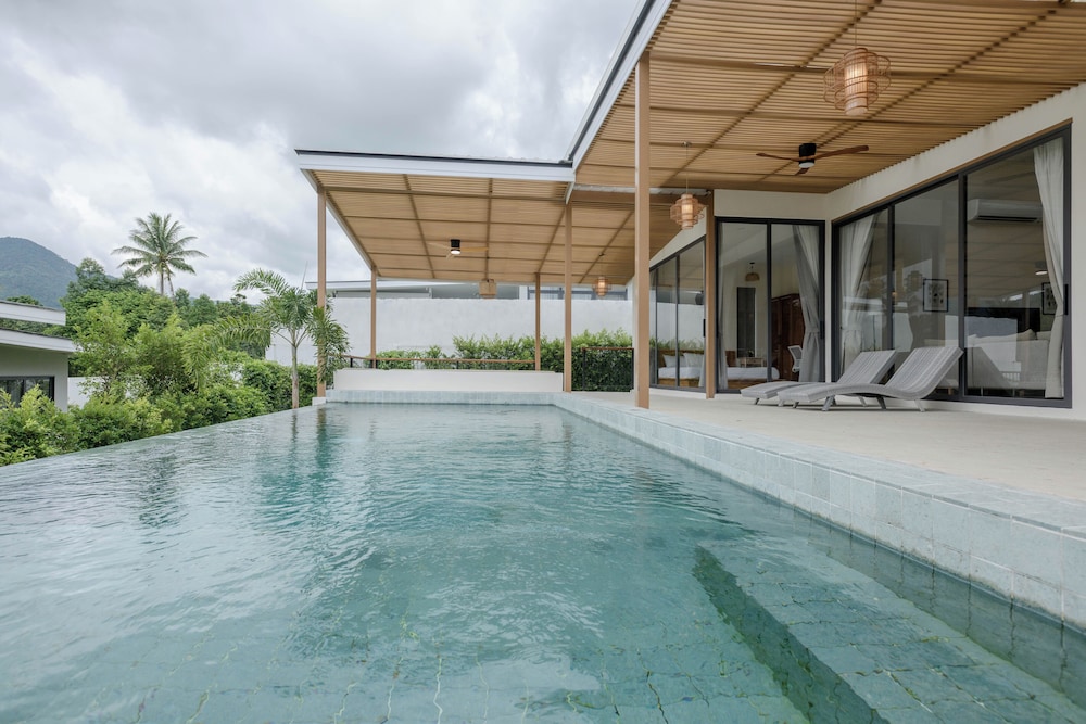 Tropical Poolside Retreat by Sea N' Rent