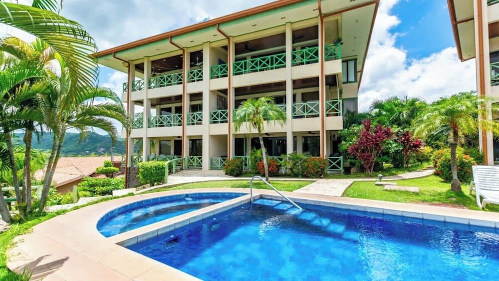 Elegant Condo with Brand-New Fixtures, Shaded Tropical Terrace, and Secluded Beach Access
