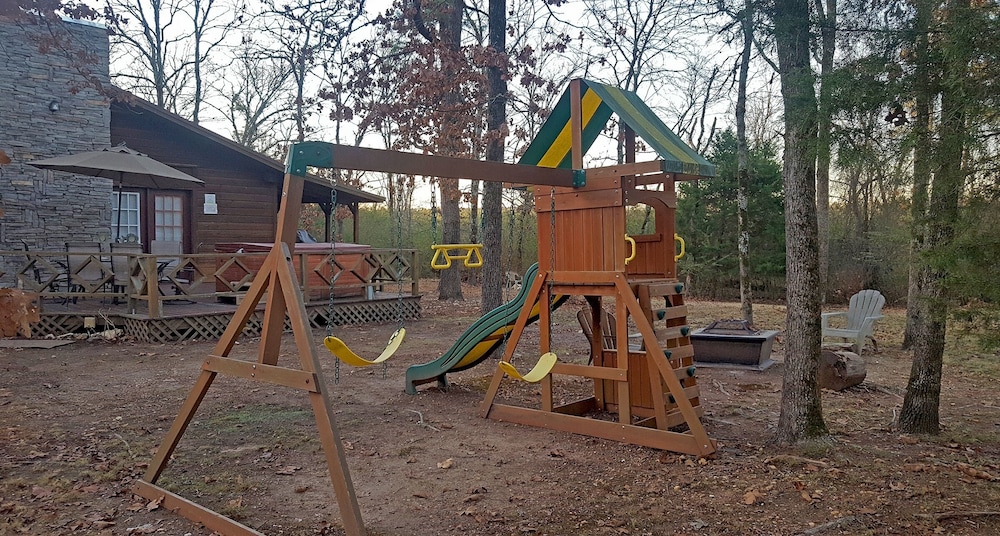 Cast Away Family Cabin with Hot Tub, Fireplace, and Kids Area by RedAwning view 3