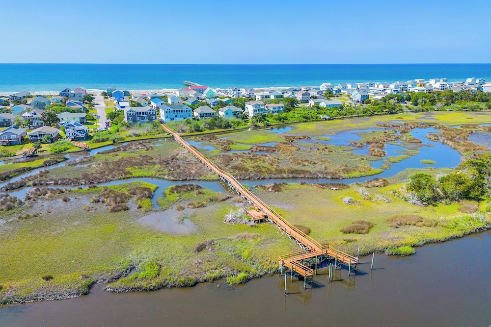 Walk to Beach: Oak Island Retreat w/ 210-yard Dock