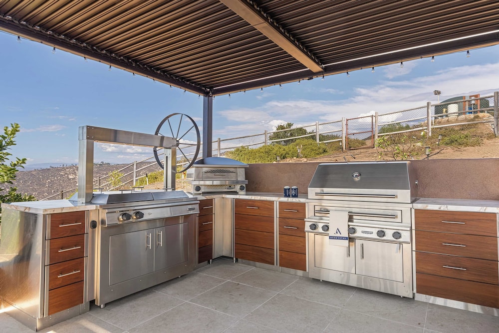 Infinity Pool, Theater, Pickleball + 360 Views Near Lake Poway Sunset Point Estate by Avantstay