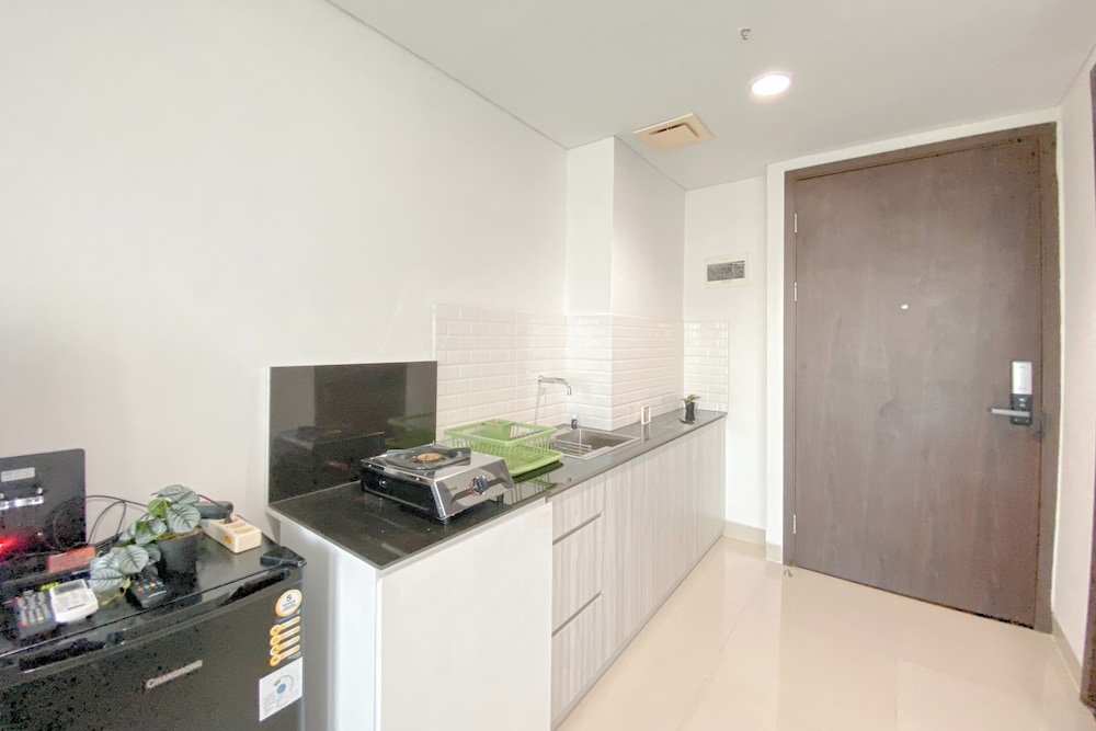 Simple White Designed Studio At Lrt City Bekasi Apartment