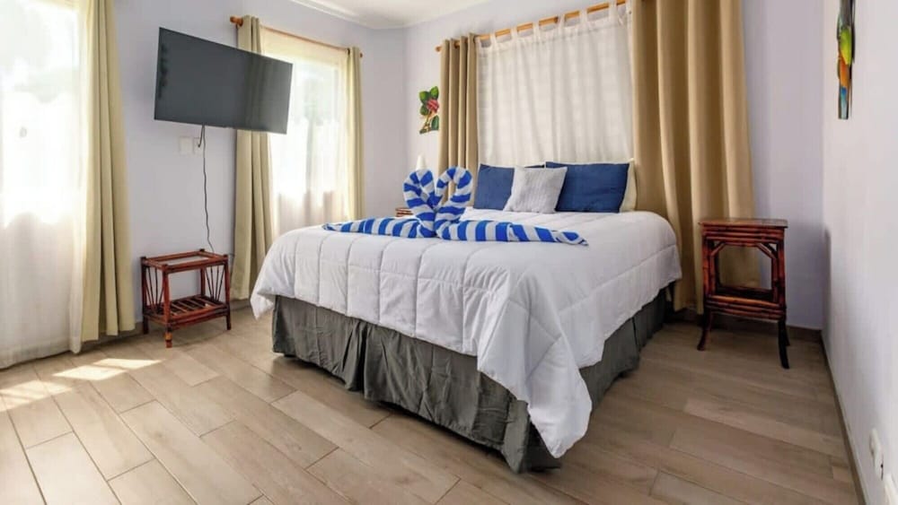 Elegant Condo with Brand-New Fixtures, Shaded Tropical Terrace, and Secluded Beach Access