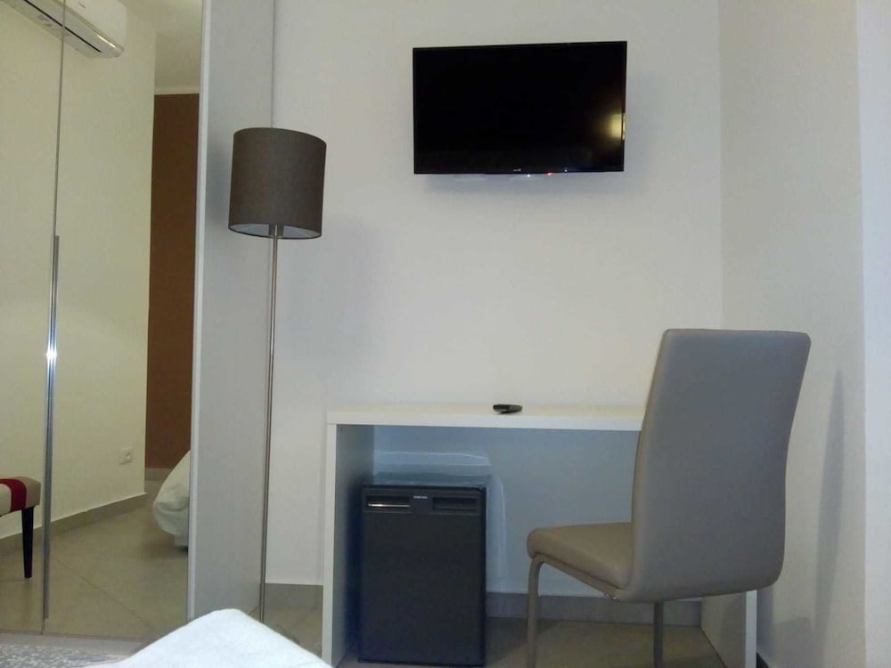 Minerva Guesthouse en Pavia — hotel room