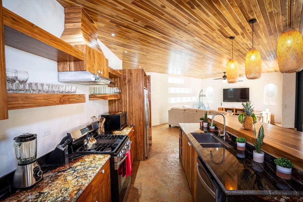 Bohemian Tropical Villa with a Tiki-Style Swimming Pool & Swim-Up Bar with an Attached Studio Apartment
