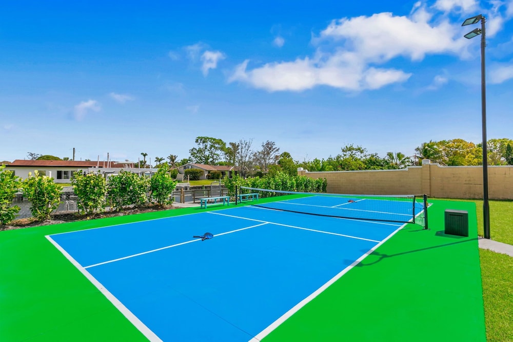Waterfront Pool Pickleball Court Game Room