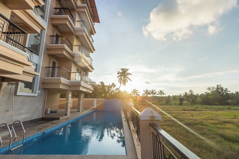 Palm Retreat 1BHK Pool & Field Views