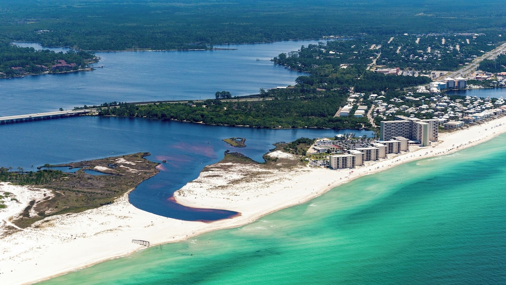 Beachfront Charm Meets Lake Life + Free Tickets: Dolphin Cruise & More!