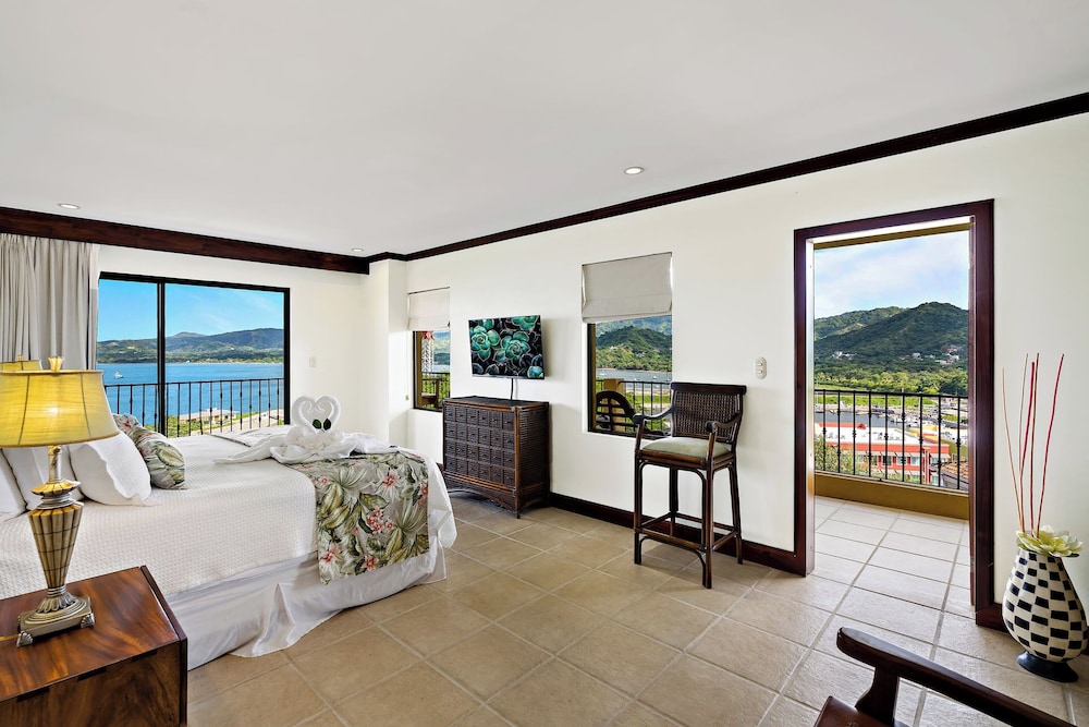 Remodeled Top-Floor Condo with Stunning Wrap-Around Balcony Offering Mountain, Ocean & Marina Views