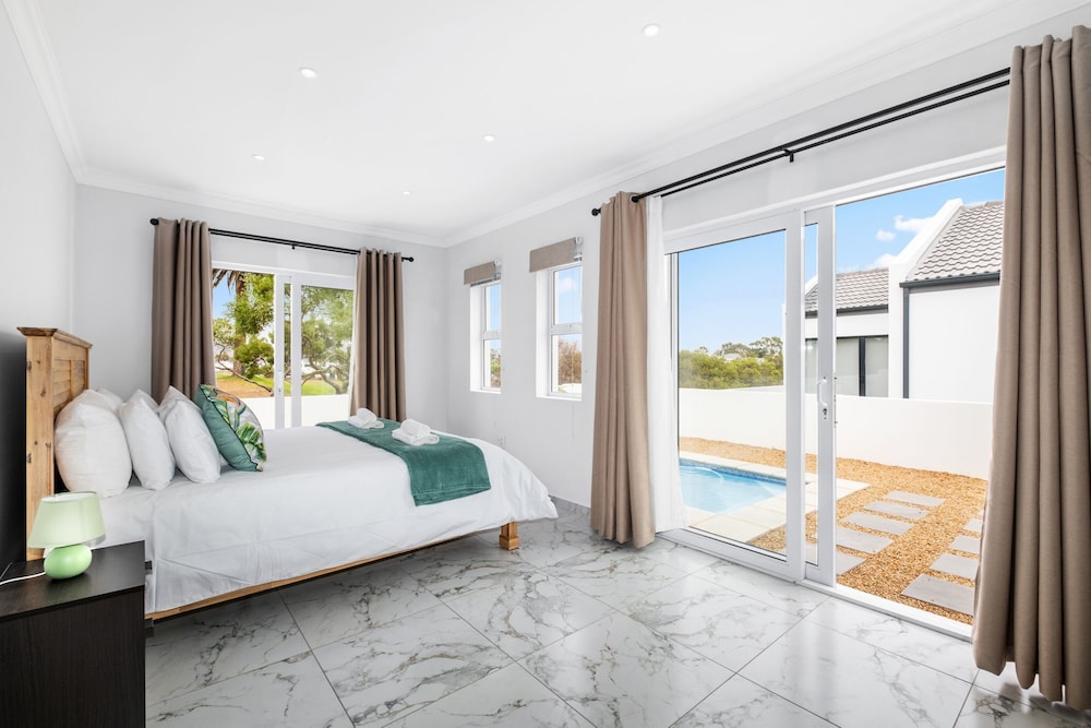 Sunlit Oasis Ocean and Golf Retreat