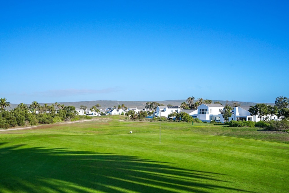 Sunlit Oasis Ocean and Golf Retreat