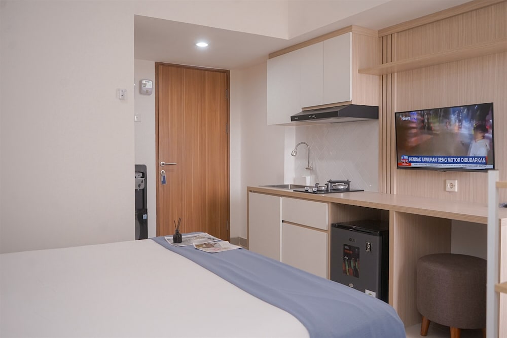 Minimalist And Warm Studio Room At Cisauk Point Apartment
