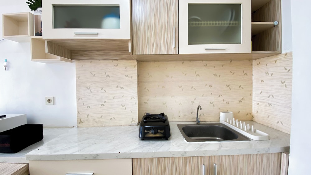 Homey And Cozy Living Studio At Poris 88 Apartment
