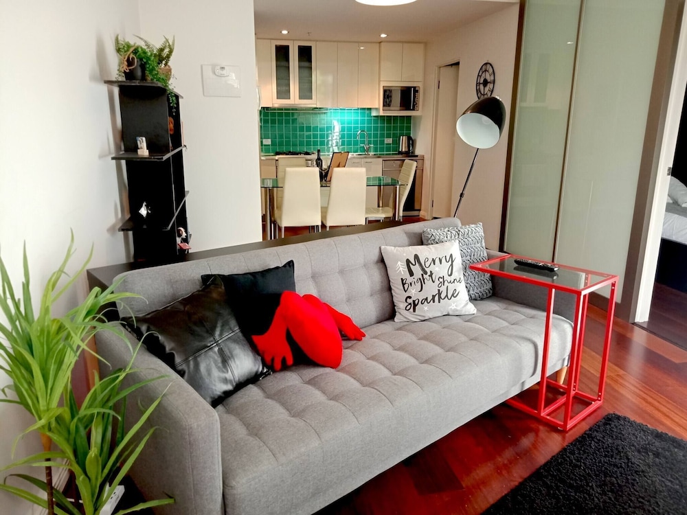 Unwind in Style at Melbourne's Historic Art Deco Apartment With Pool Gym Carpark