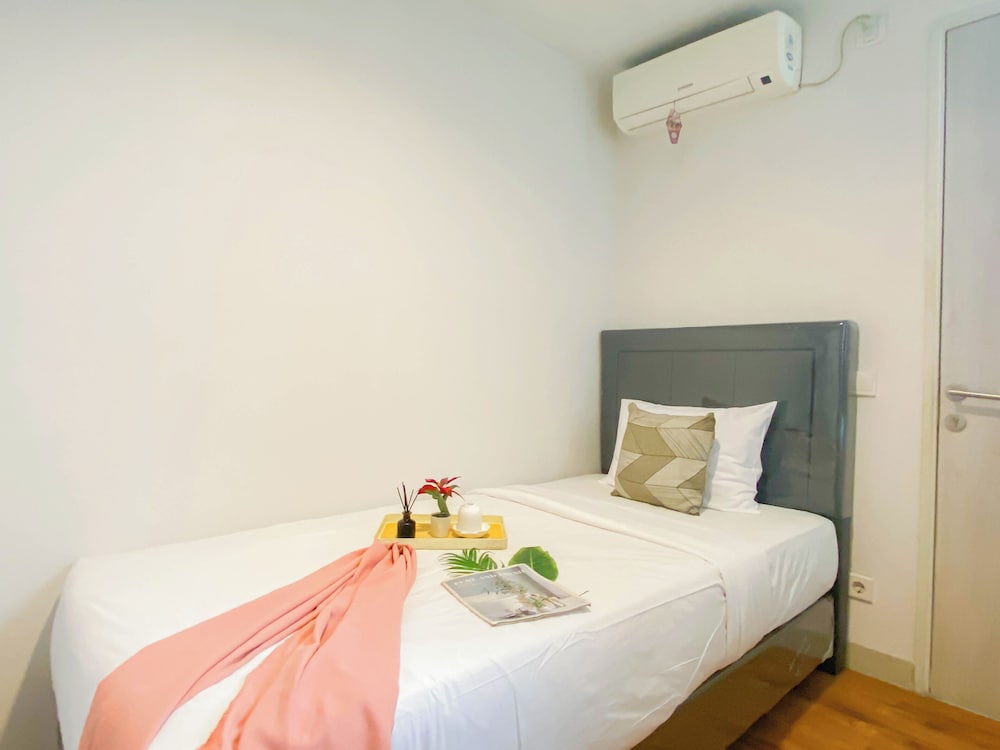Simple 2Br At Azalea Suites Apartment