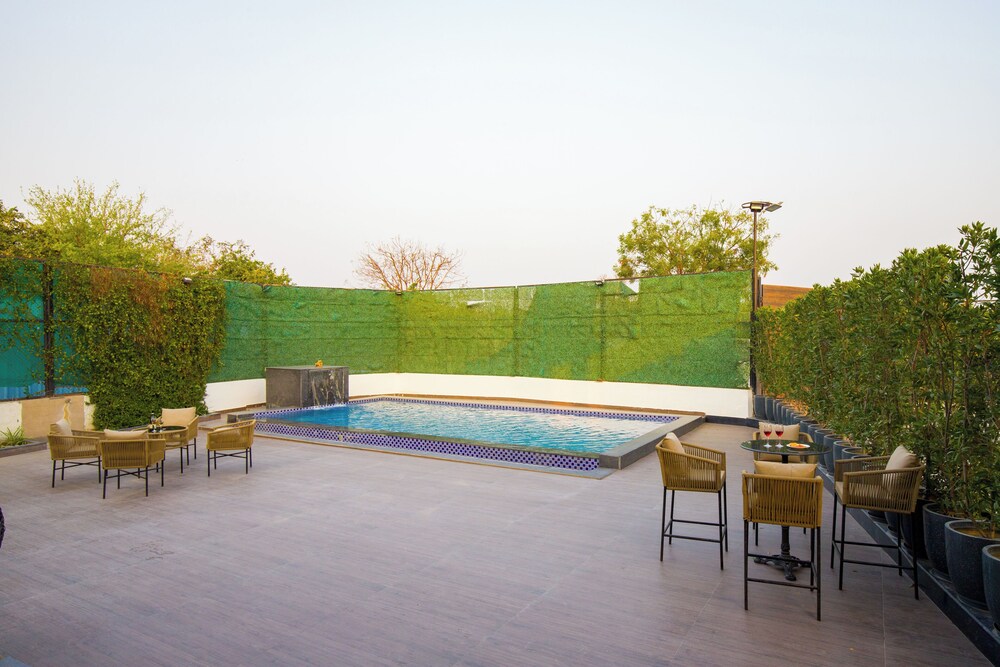 ELIVAAS Ibiza Luxe 4-BHK Farmhouse