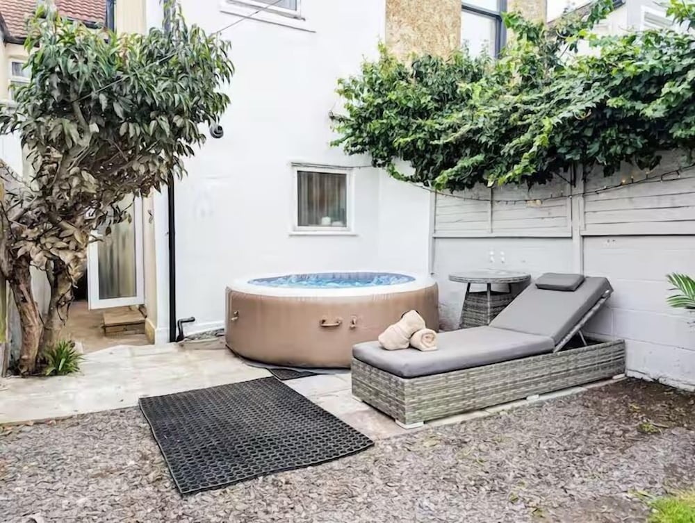 Central 3BR Home with Hot Tub Sleeps 10