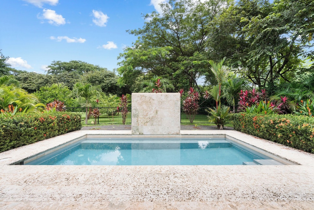 Beautiful home in a gated Neighborhood, Walking Distance to Beach with Garden