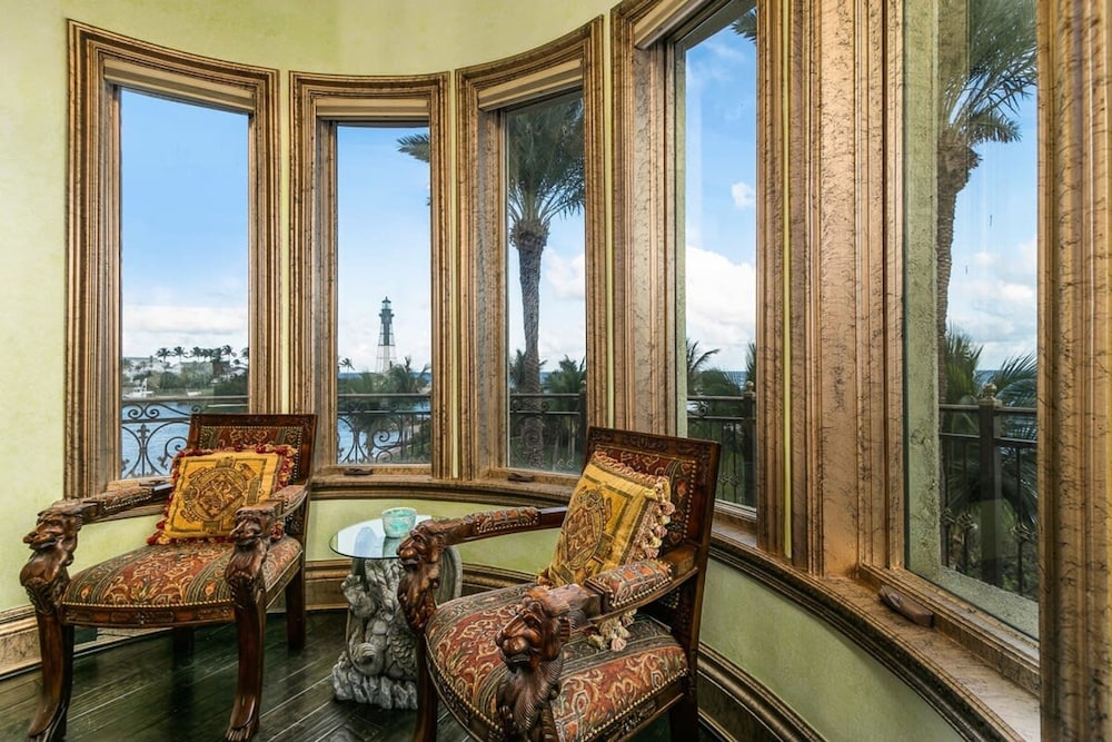 Luxurious 3-story Estate With Gym Pool Slide Private Beach and Lighthouse Views
