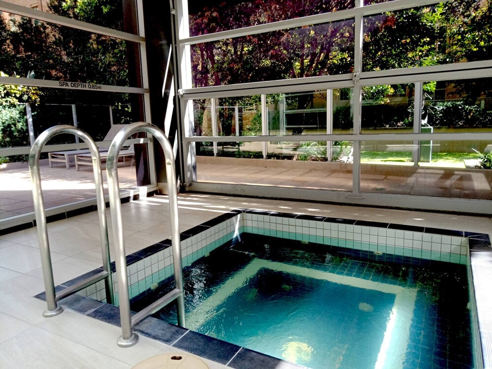 Unwind in Style at Melbourne's Historic Art Deco Apartment With Pool Gym Carpark