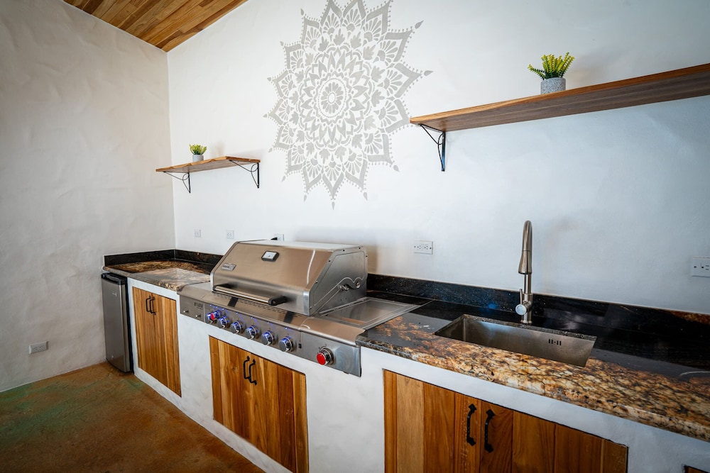 Bohemian Tropical Villa with a Tiki-Style Swimming Pool & Swim-Up Bar with an Attached Studio Apartment