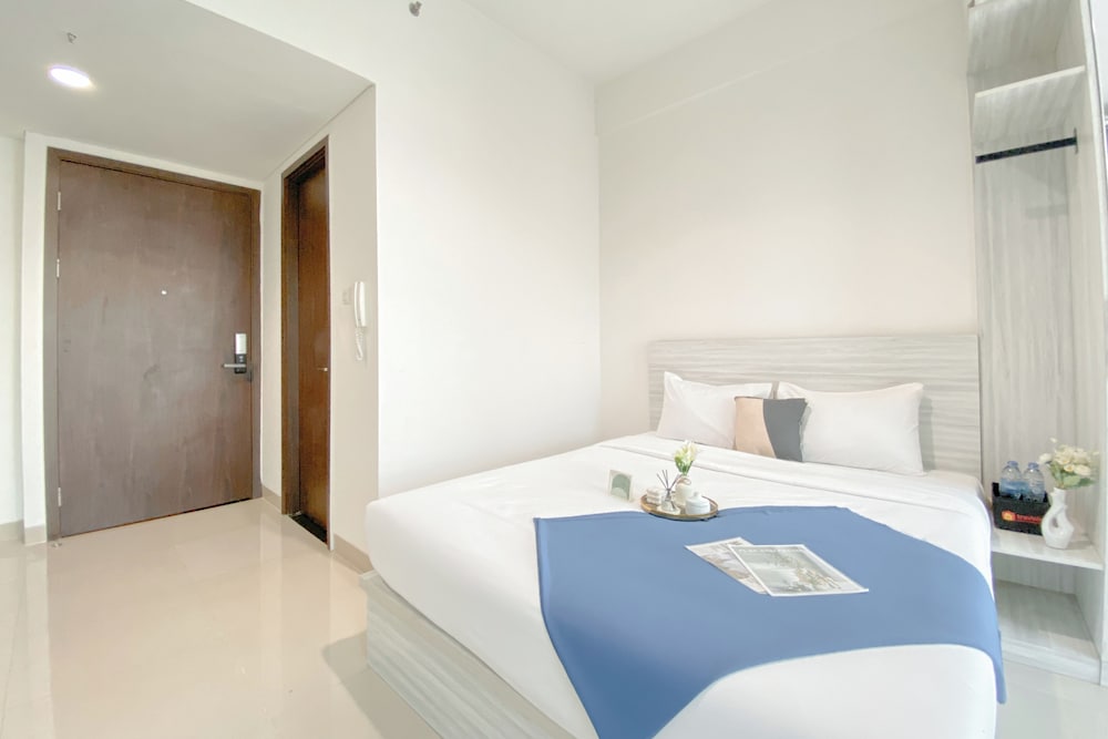Simple White Designed Studio At Lrt City Bekasi Apartment
