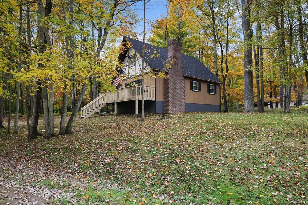 Game Room & Fire Pit: Tree-lined Pocono Lake Cabin view 4
