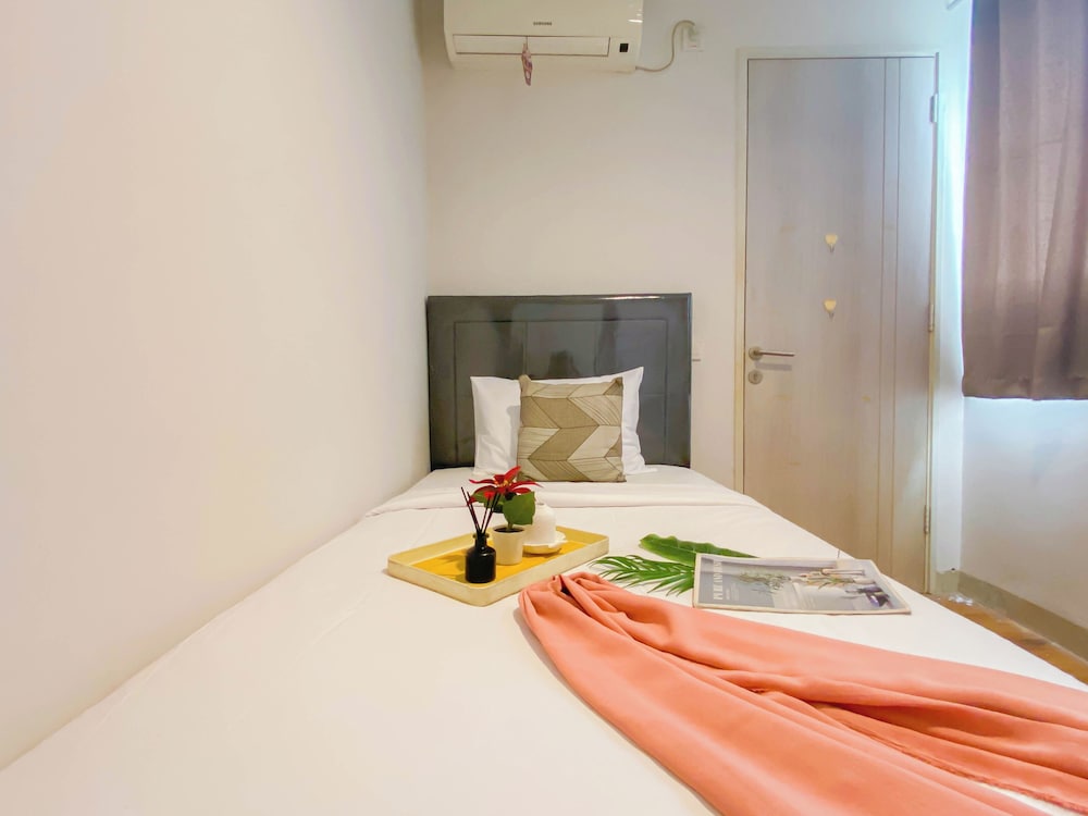 Simple 2Br At Azalea Suites Apartment