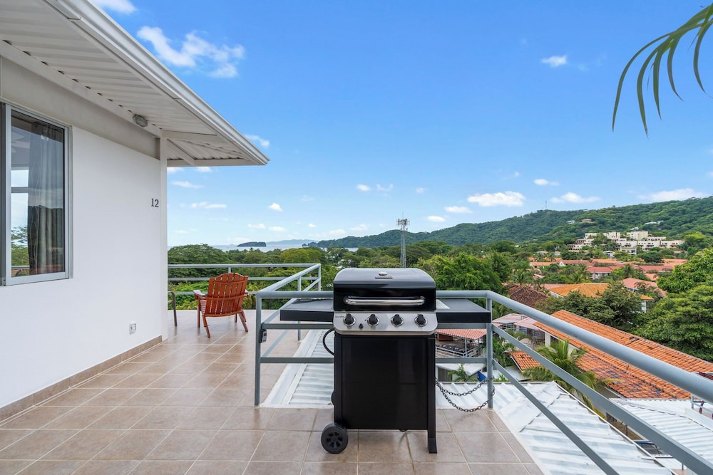 Modern Top-Floor Condo with Panoramic Views and Community Pool