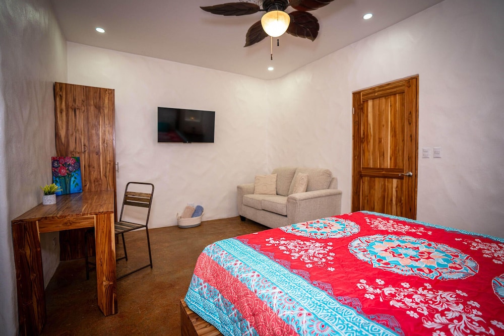 Bohemian Tropical Villa with a Tiki-Style Swimming Pool & Swim-Up Bar with an Attached Studio Apartment