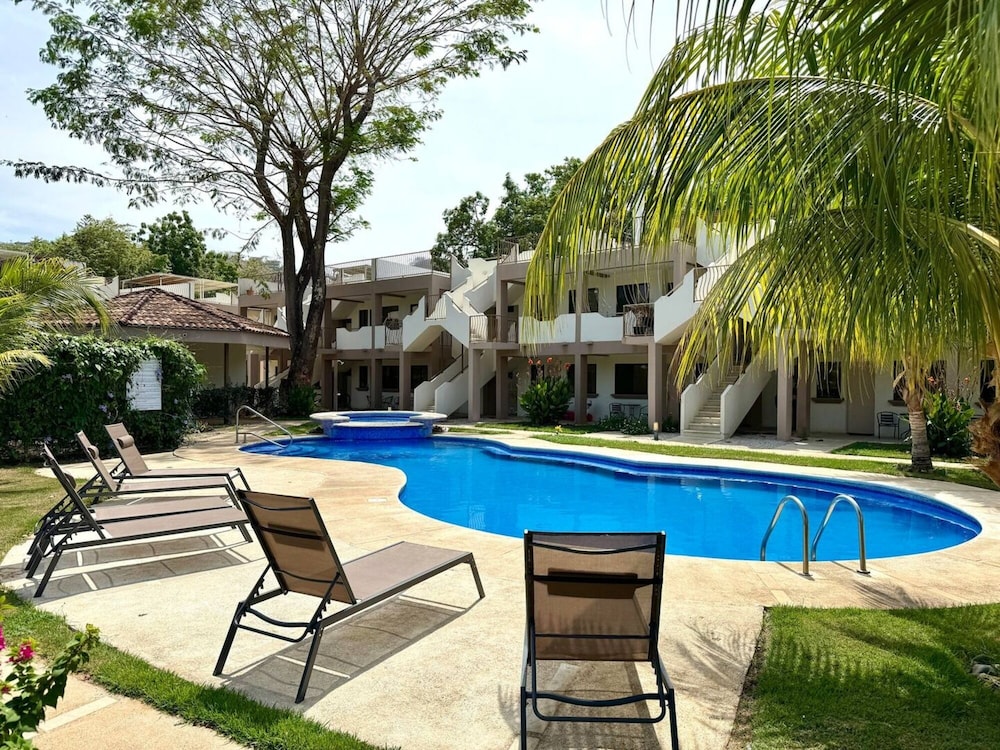 Cozy Condo with Panoramic Hillside Views from Rooftop Terrace and Short Walk to Beach