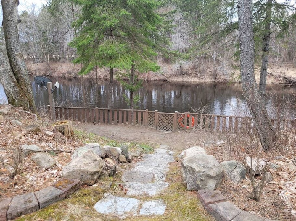 Whispering Pines Riverside Getaway
