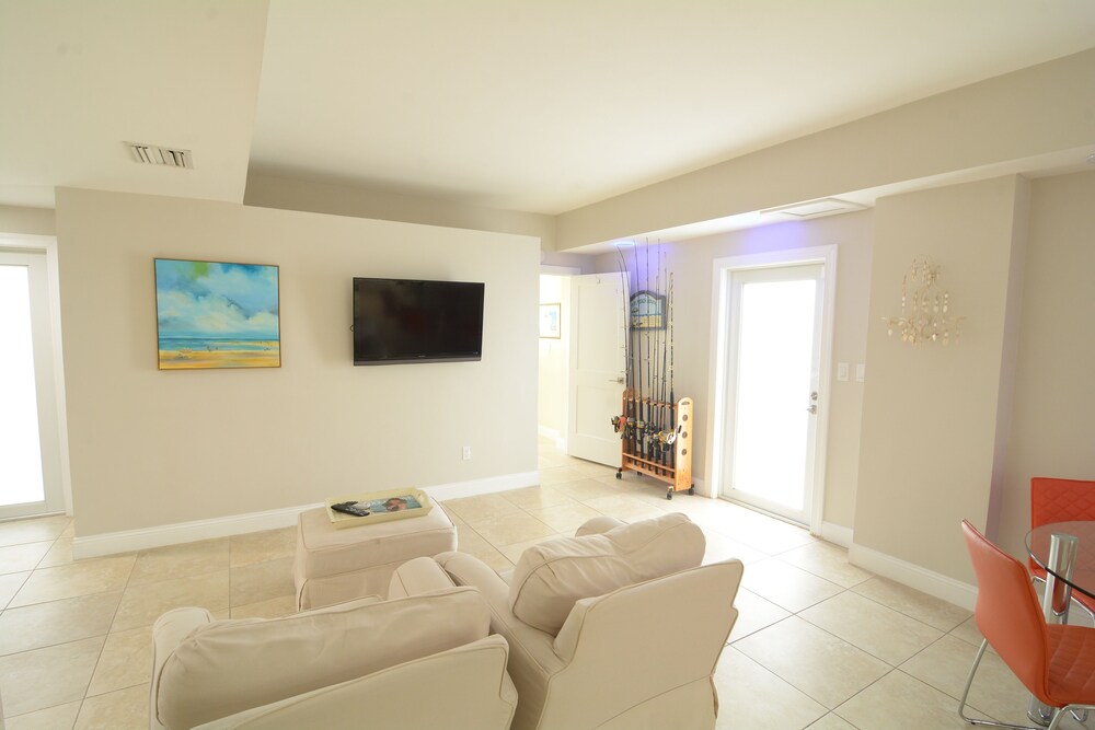 Beautiful Canal Front Home With Above Ground Pool, Dock And Fish Cleaning Station 4 Bedroom Home by RedAwning