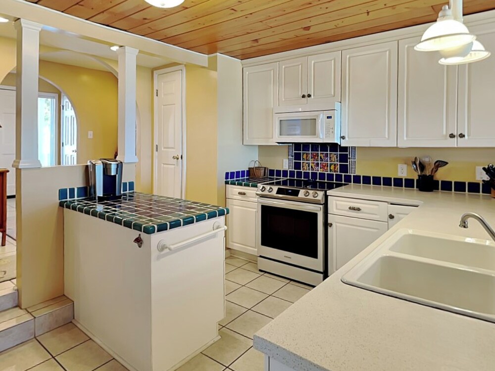 A Charm of Finches by Topsail Realty