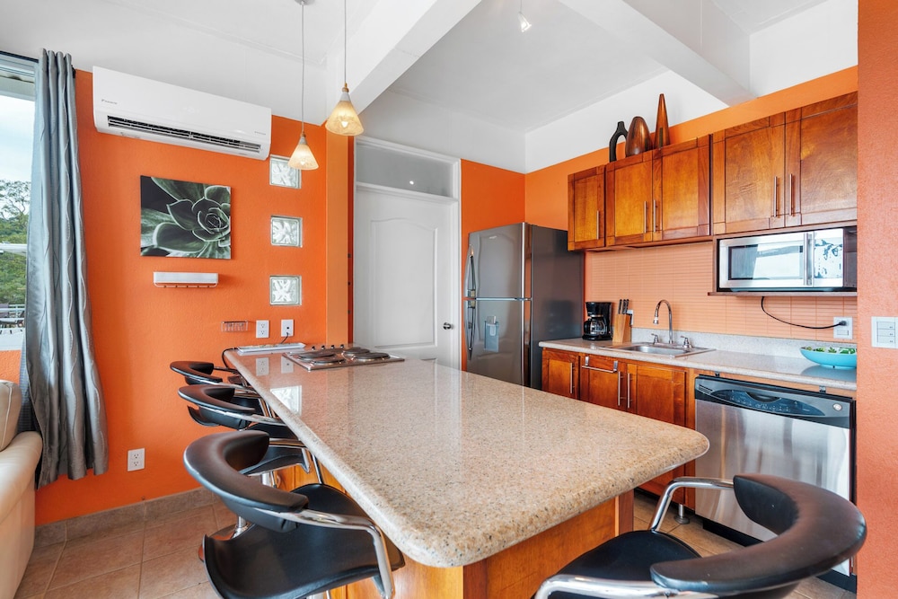 Modern Top-Floor Condo with Panoramic Views and Community Pool