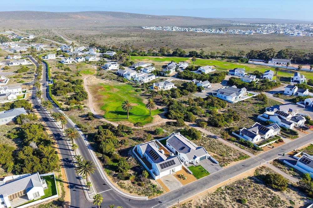Sunlit Oasis Ocean and Golf Retreat