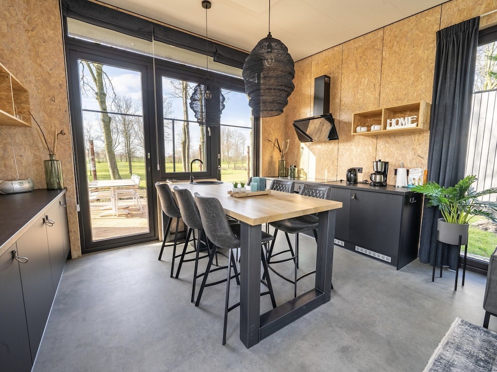 Modern Chalet by the River Maas