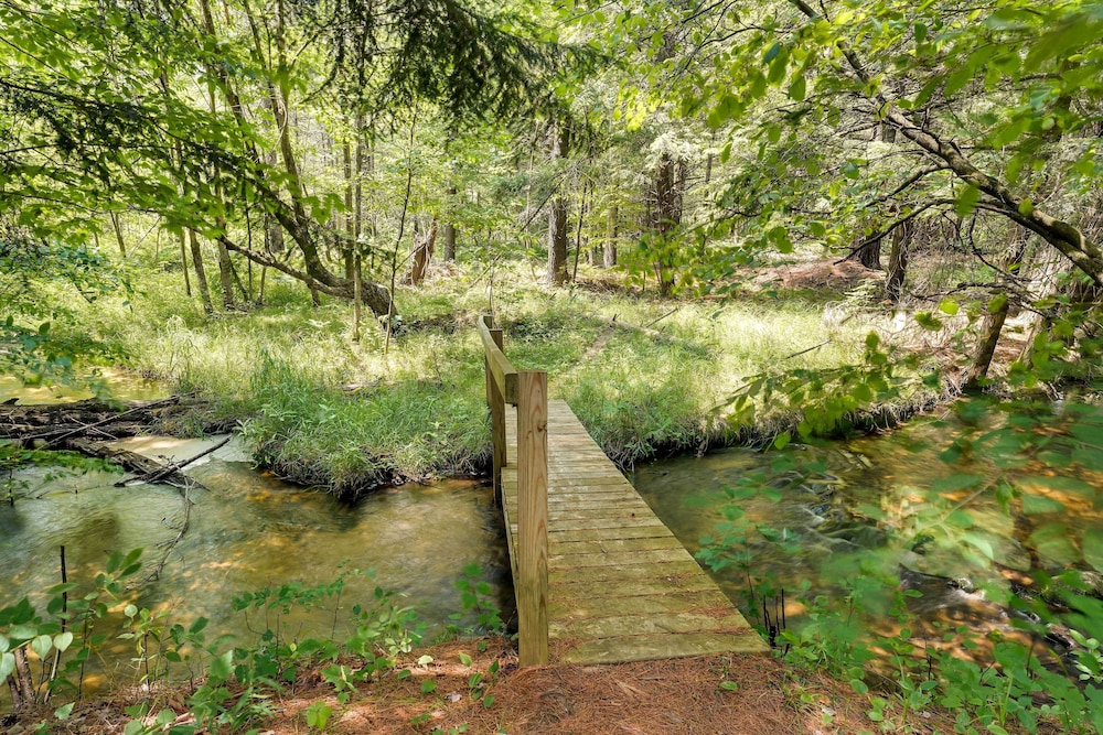 Secluded Log Cabin in NW Michigan: Hot Tub Deck - Property Image 15